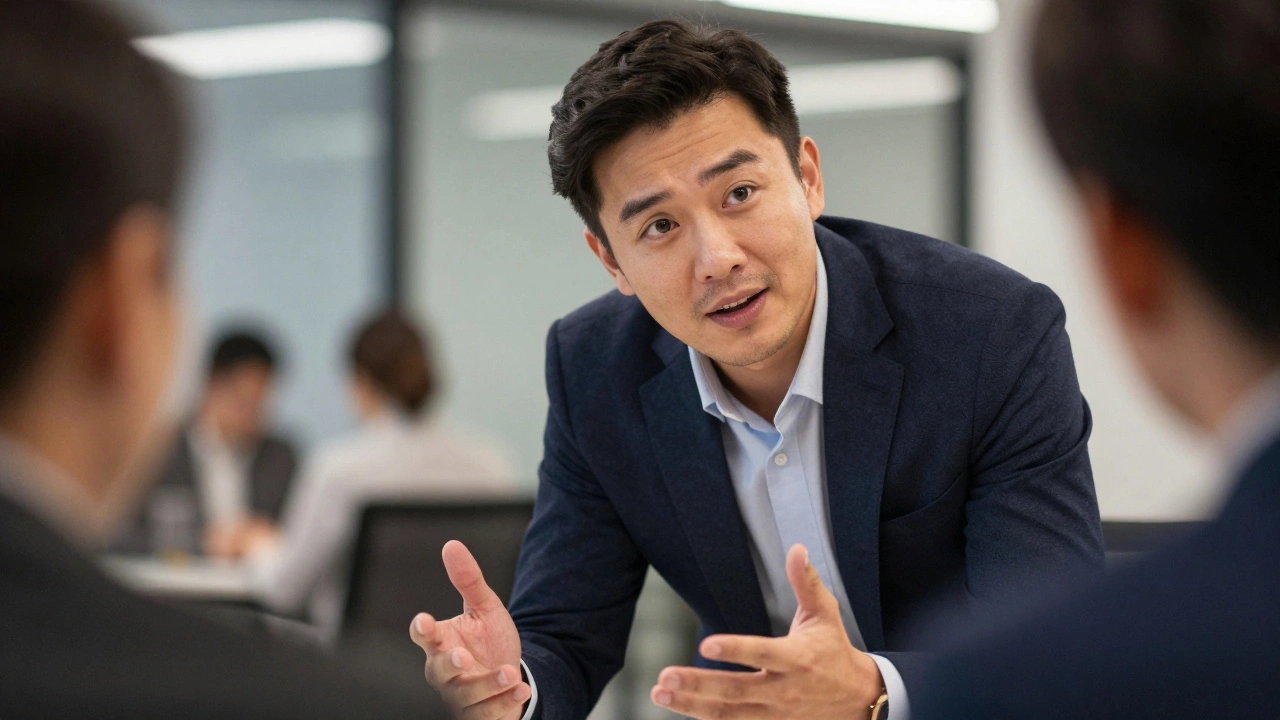 Trainer listening attentively to a participant in an office.